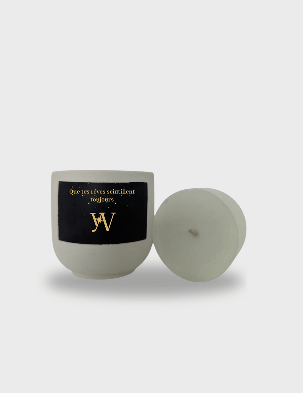 Bougie parfumée artisanale taille M en cire végétale avec pot en jesmonite réutilisable. Message caché révélé à la chaleur : “Que tes rêves scintillent toujours”. Fabrication artisanale.